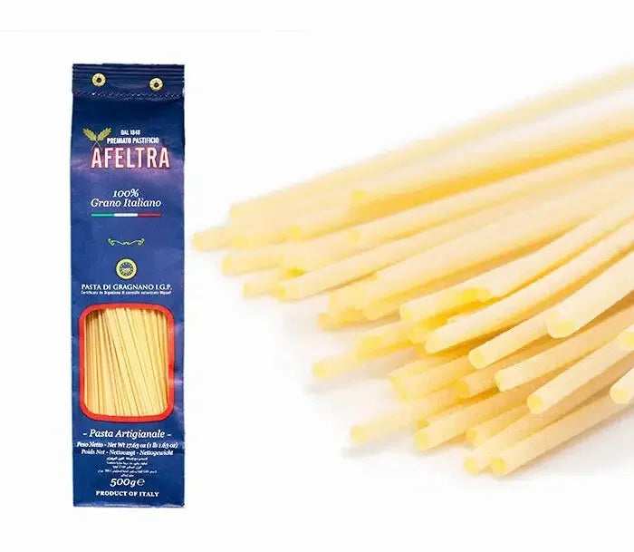 Packet of Afeltra classic Italian spaghetti pasta made from 100% Italian durum wheat with close-up of uncooked spaghetti strands