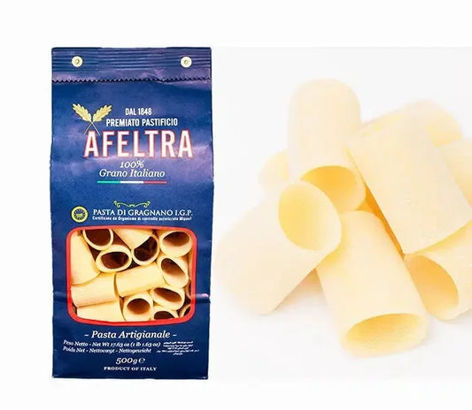 Afetra premium artisanal Italian paccheri pasta in blue packaging and loose pasta pieces