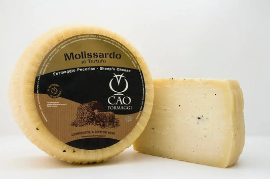 Whole and sliced Pecorino Molissardo truffle sheep's cheese with brown label on white background