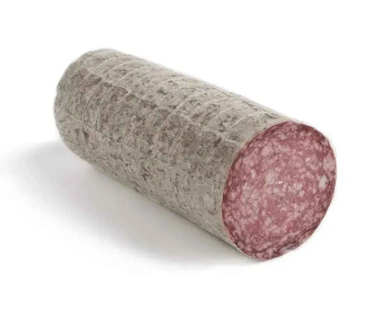 Whole cured salami with gray rind and visible marbled pink meat on white background