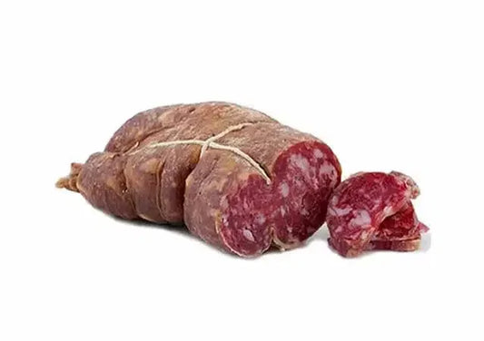 Whole and sliced soppressata dry cured Italian salami with white fat marbling on white background