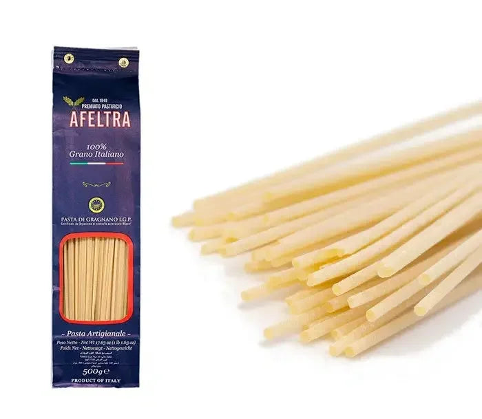 Afelta 500g package of premium thick Italian spaghettoni pasta made from 100% Italian grain, with close-up of uncooked pasta strands